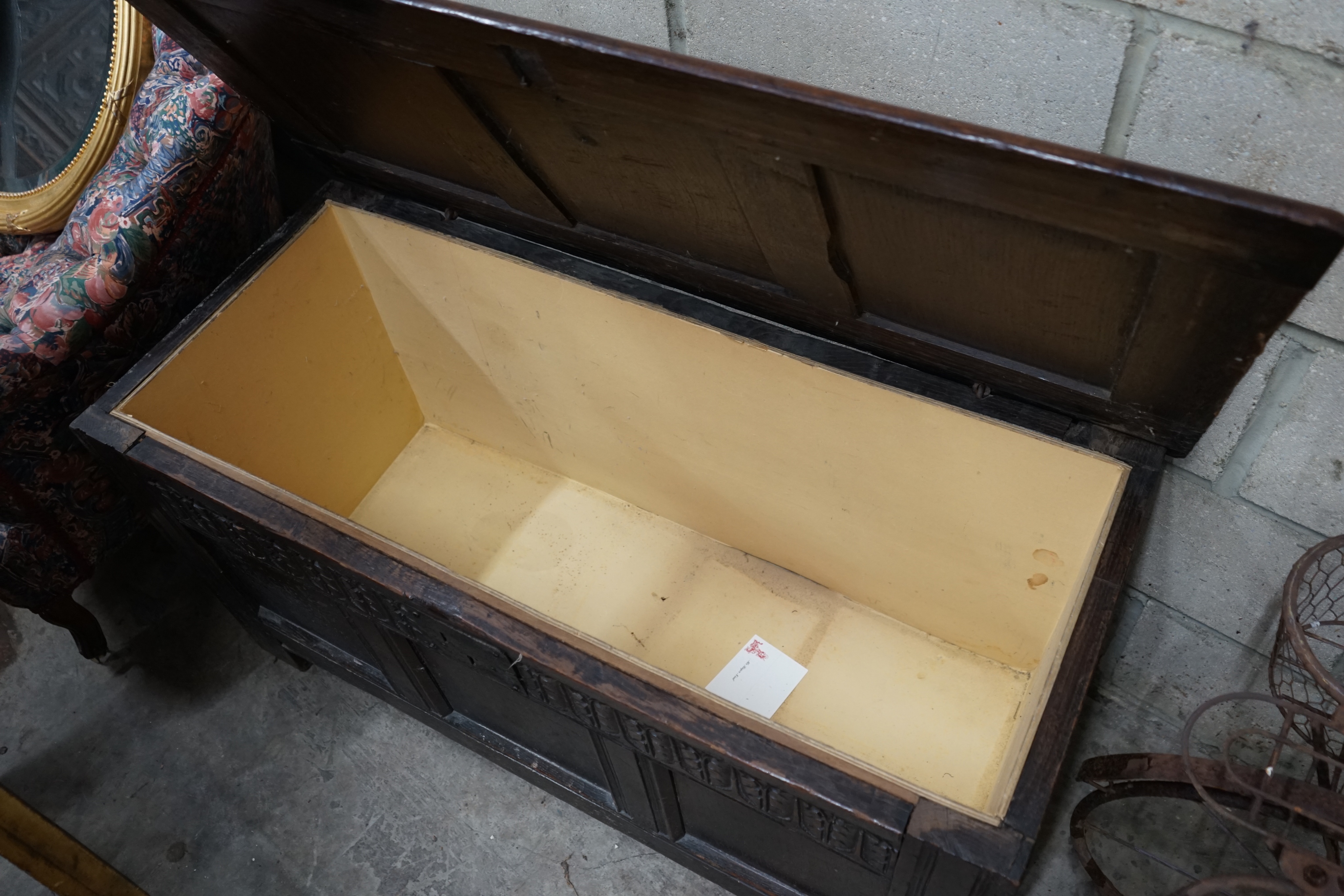 An 18th century oak coffer (re-lined), width 108cm depth 49cm height 56cm